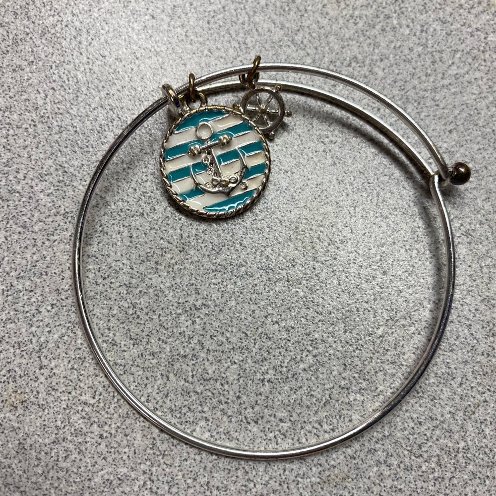 Silver bracelet with teal anchor charm